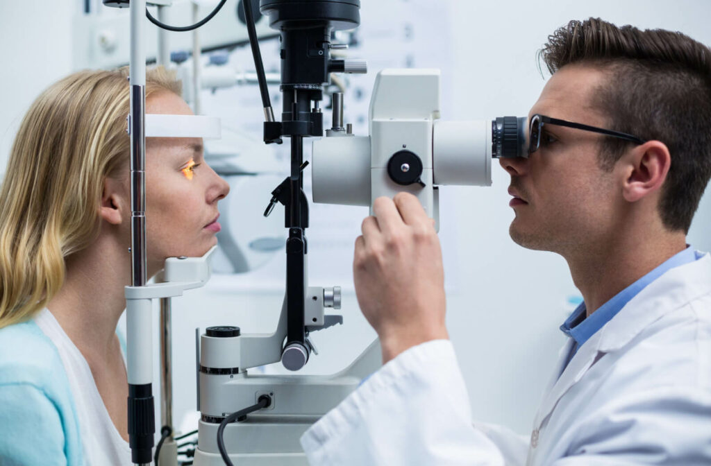 A woman receives a dry eye exam from her optometrist.