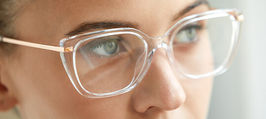 Clouse-up of women face in reading glasses.