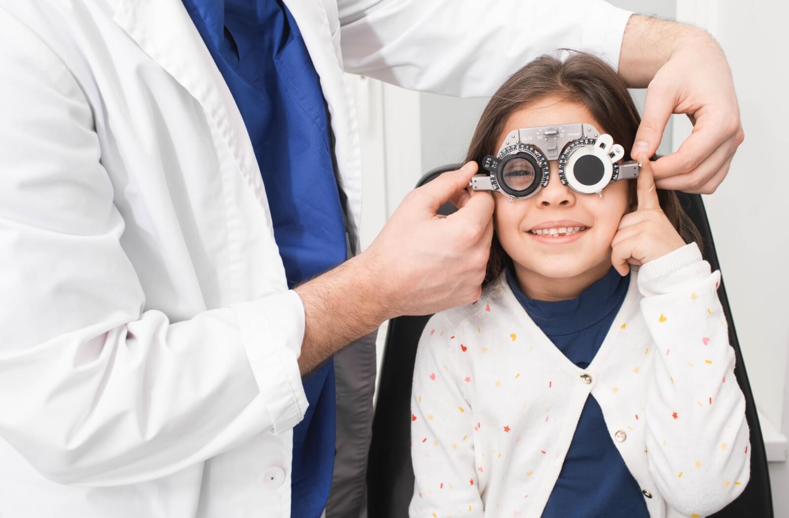 A child is at the optometrist's getting an eye exam.